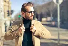 selective focus photography of man wear brown blazer and eyeglasses